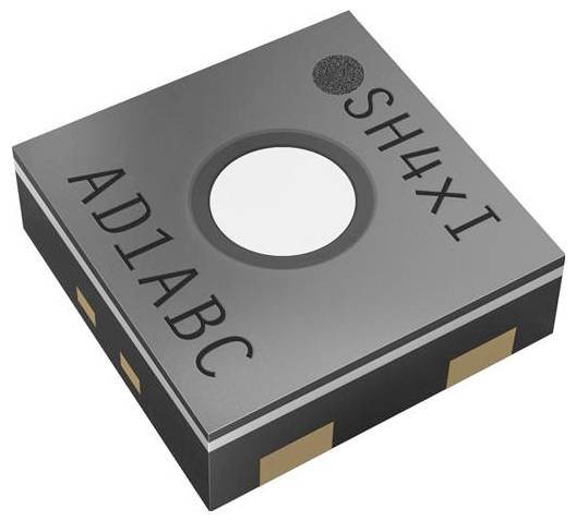 Malé, štvorcové púzdro elektronického snímača označené štítkami 'AD1ABC' a 'SH4XI' so zlatými konektormi, používané v zariadeniach na meranie environmentálnych údajov.
