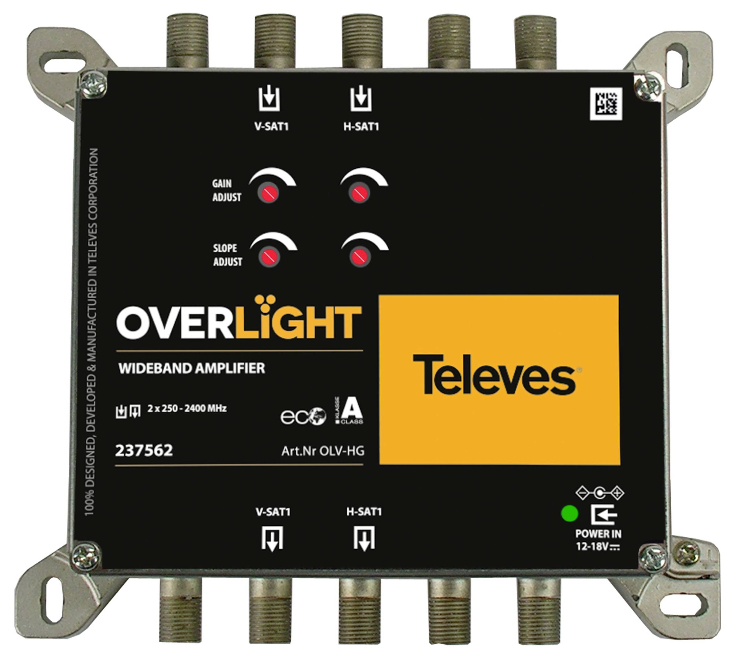 Obdĺžniková širokopásmová zosilňovač označená ako „OVERLIGHT" a „Televes" s ovládacími prvkami na nastavenie ziskov a sklon. Viditeľné sú viaceré vstupné a výstupné porty.