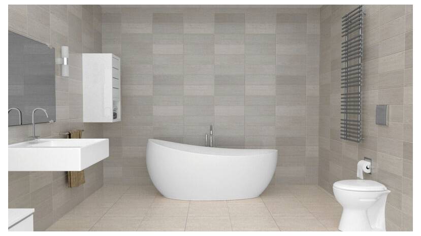 Moderná kúpeľňa s voľne stojacou bielou vaňou, nástenným umývadlom, obdĺžnikovým zrkadlom a ohrievačom uterákov. Neutrálne obkladané steny a podlaha.