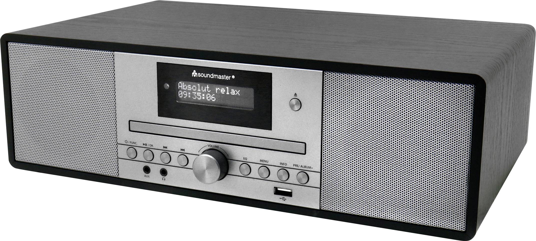Obdĺžnikové čierno-strieborné rádio s digitálnym displejom zobrazujúcim 'Absolut relax' a frekvenciu '99.35'. Vybavené gombíkmi a tlačidlami.