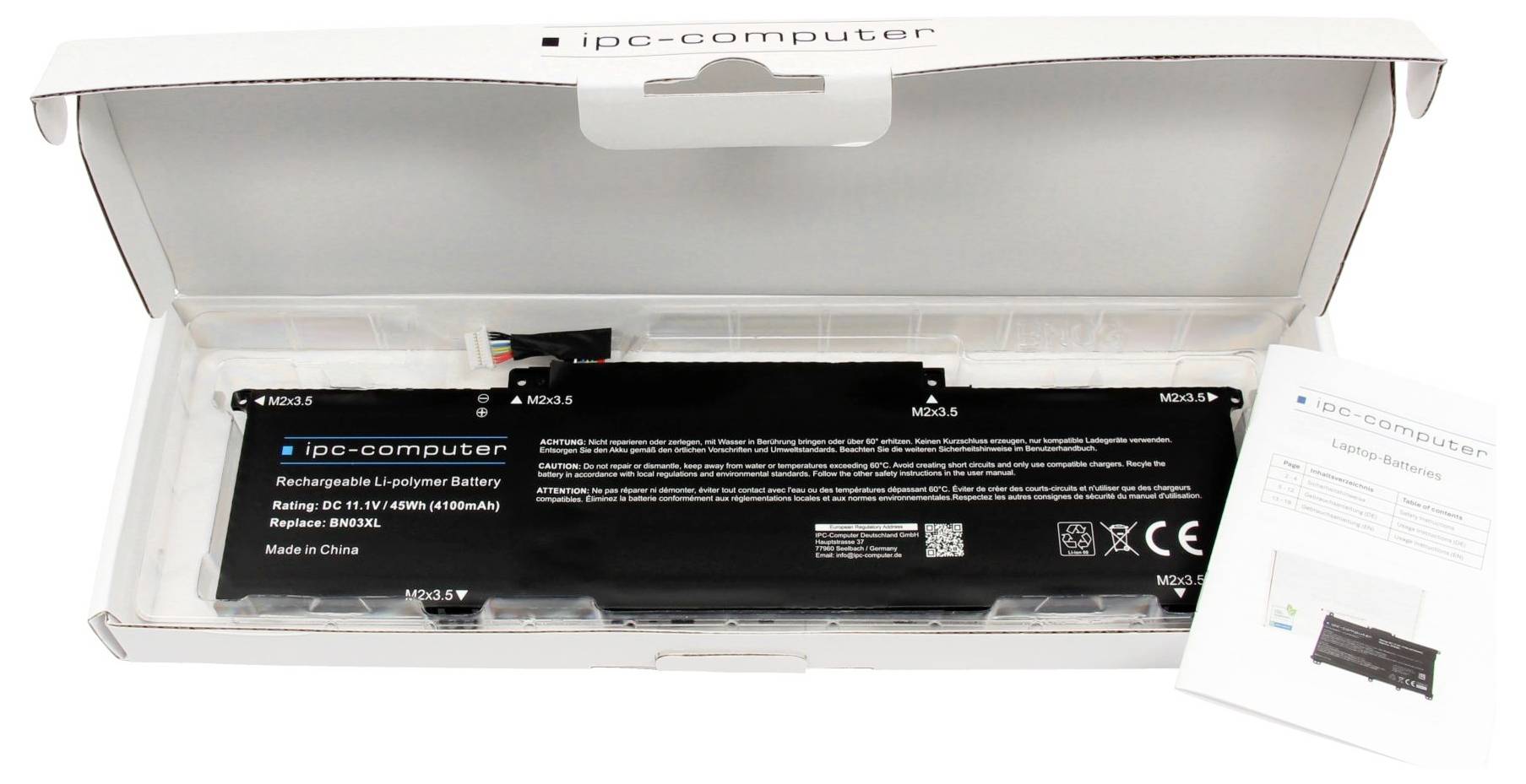 Náhradná batéria do laptopa v obale, označená štítkom "ipc-computer", zobrazujúca technické špecifikácie a používateľský manuál v balení.
