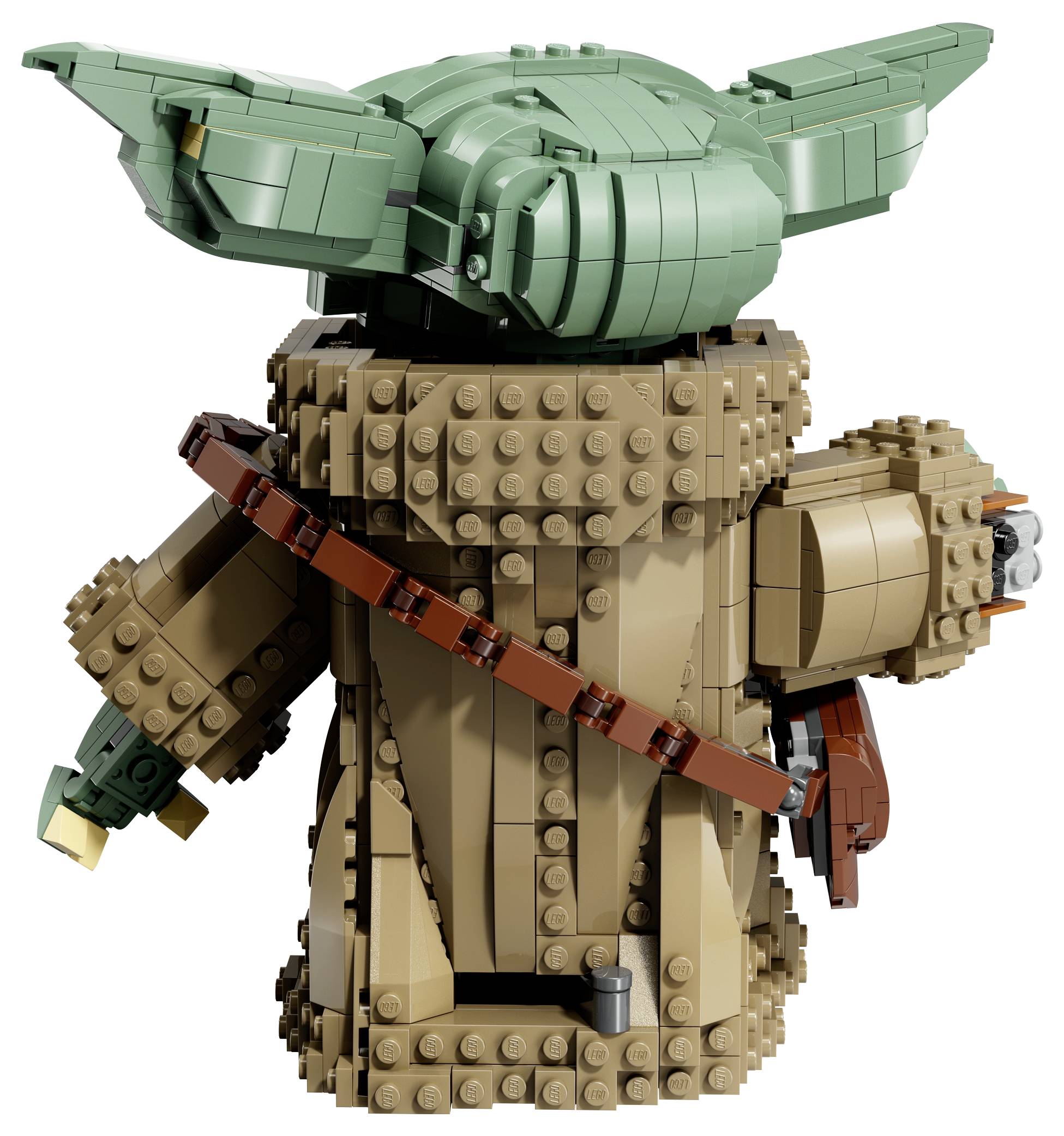 Detailná figúrka Lego postavy so zelenými ušami a hnedým habitom. Figúrka je viditeľná zozadu a drží v ruke malý predmet.