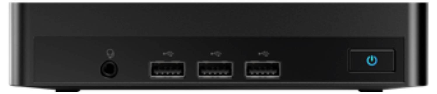 'Pohľad zpredu na čierny stolný počítač, ktorý ukazuje tri USB porty, audio jack a modrý vypínač na pravej strane.'