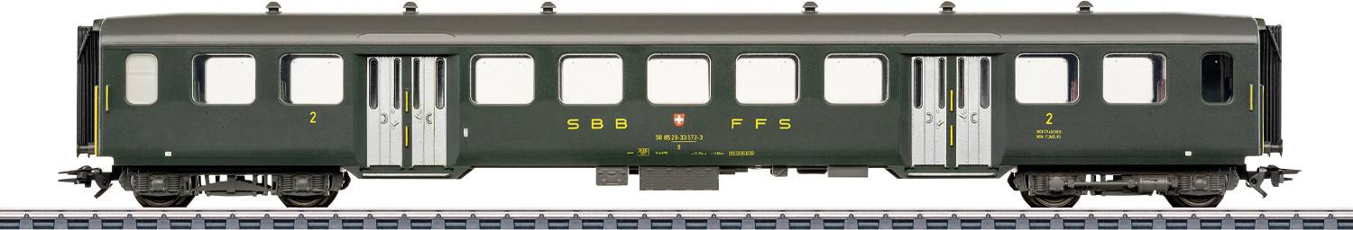 Starožitný zelený železničný cestujúci vozňový automobil s označením „SBB CFF FFS" na boku, ktorý ukazuje klasický dizajn z polovice dvadsiateho storočia.