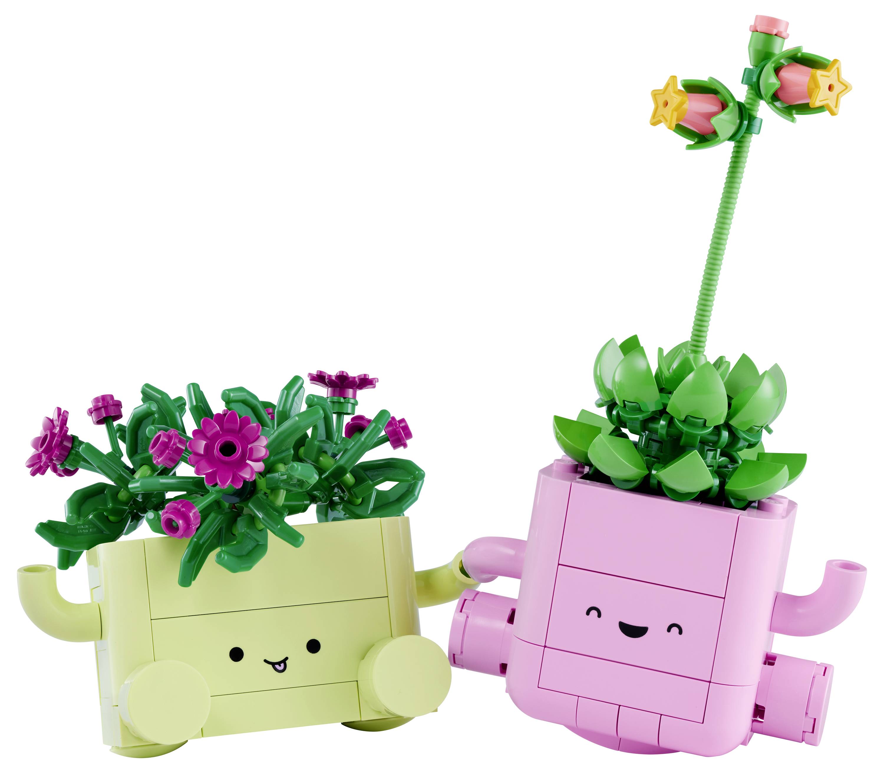Dva usmiati kvetináče v štýle LEGO, jeden žltý s ružovými kvetmi a jeden ružový s vysokou zelenou stonkou a hviezdičkovými kvetmi.