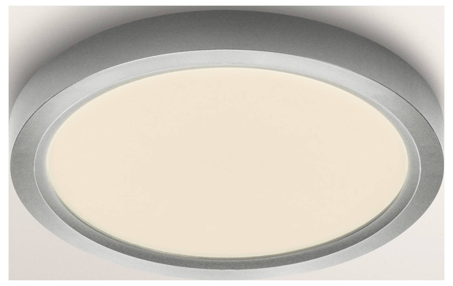 Zblížený pohľad na kruhovú, zapustenú LED stropnú lampu so štíhlym, moderným dizajnom a jemným, teplým žiarom.