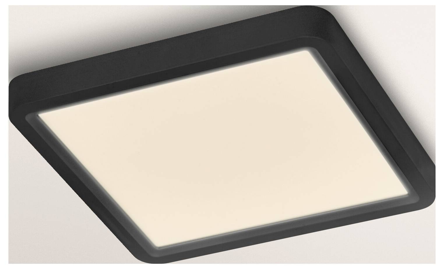 Štvorcové stropné LED svetlo s čiernym rámom a jemným teplým bielym svetlom, namontované na bielom strope.