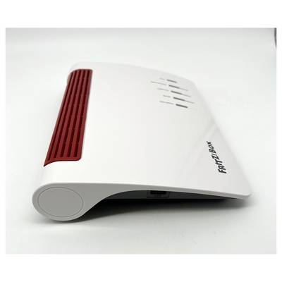 Biely a červený Wi-Fi router s názvom „FRITZ!Box" s ventilačnými otvormi na vrchu a niekoľkými indikačnými svetlami.