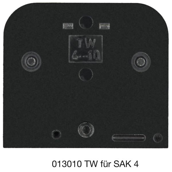 Čierna elektrickej zásuvka/zadná platňa s viacerými otvormi na skrutky a označením „TW 4-10"; popis znie „013010 TW pre SAK 4".
