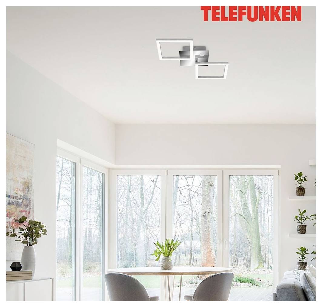 Jasná jedáleň so okrúhlym stolom, stoličkami, veľkými oknami, rastlinami a stropným svetelným telieskom; „TELEFUNKEN" sa zobrazuje v hornej časti.