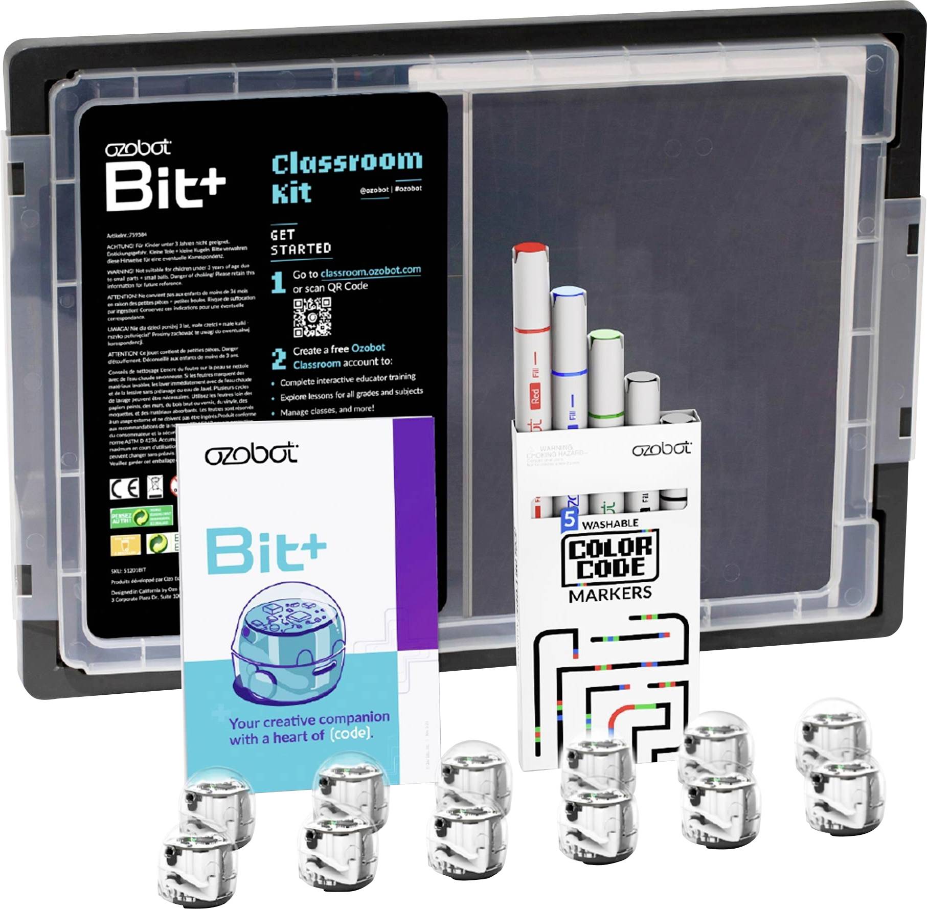 Ozobot Bit+ Classroom Kit s fixami, kódovacími kartami a niekoľkými malými robotickými hračkami zobrazené pred úložným puzdrom.