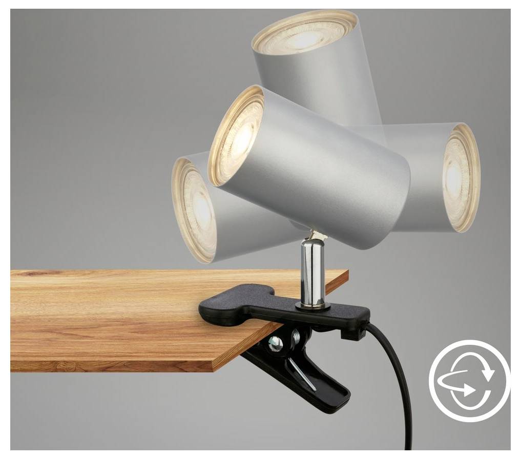 Upevňovacia reflektorová lampa so štyrmi nastaviteľnými striebornými lampovými hlavicami pripevnenými na okraj dreveného povrchu, ktorá ukazuje flexibilitu smerovateľného osvetlenia.