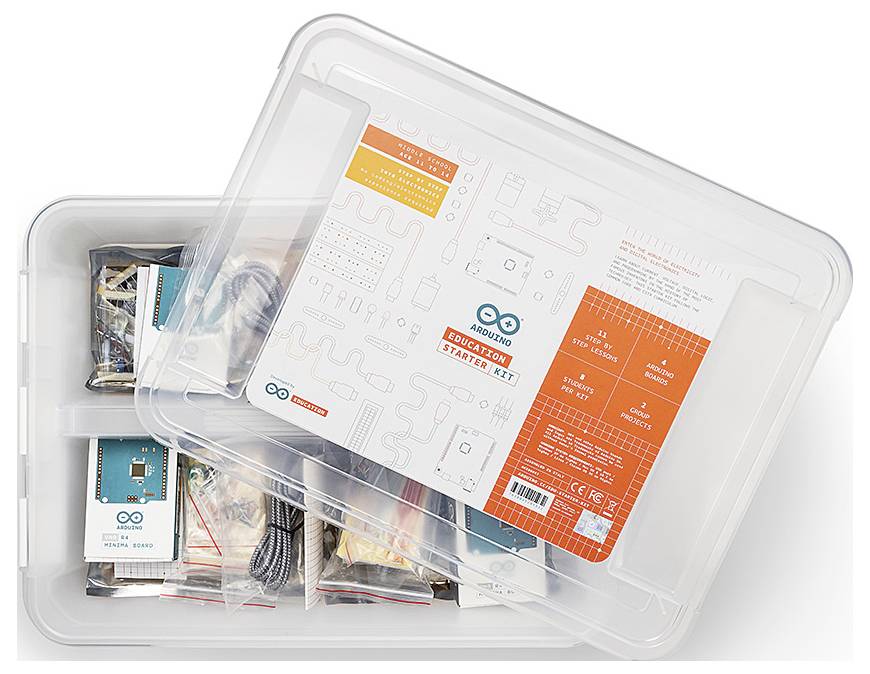 Priehľadná plastová krabica sady Arduino Education Starter Kit s viditeľnými komponentmi a návodmi v jej vnútri, zobrazená z pohľadu zhora s čiastočne otvoreným vekom.