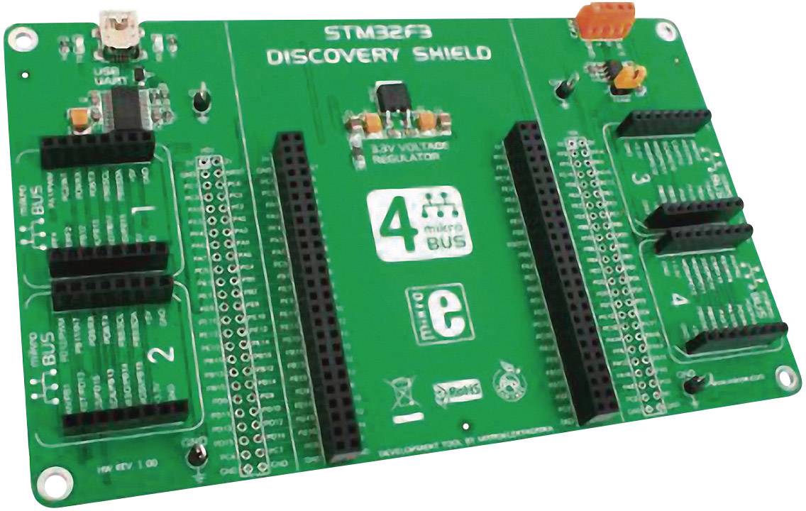 Zelená doska plošných spojov s nápisom 'STM32F3 DISCOVERY SHIELD', s niekoľkými konektormi a slotmi pre elektronické komponenty.