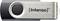 Strieborný USB kľúč s čiernym uzáverom a logom značky 'Intenso' na kovovom povrchu.
