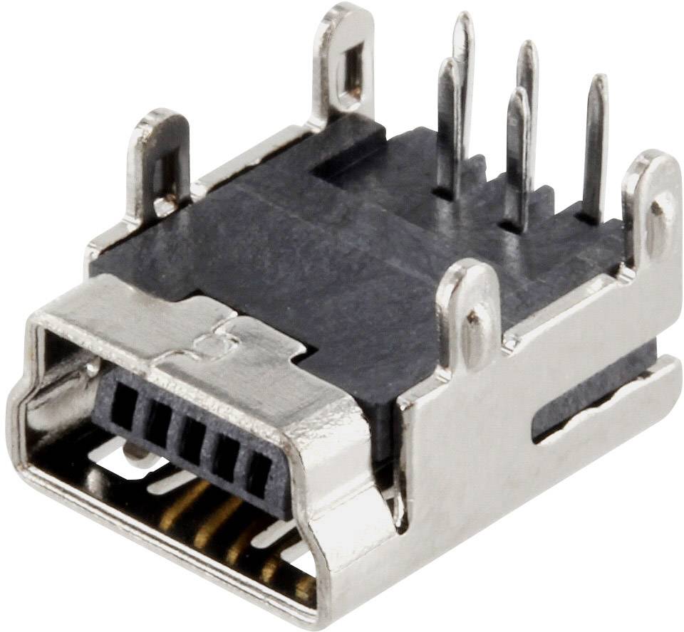 USB-B zásuvka, obdĺžnikového tvaru, so štyrmi viditelnými pinmi a kovovým krytom. Slúži na pripojenie USB káblov k zariadeniam.
