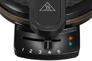 Čierny termostat na vaflovači so stupnicou od 1 do 5 pre nastavenie teploty; dva kontrolné svetlá indikujú prevádzku a pripravenosť.