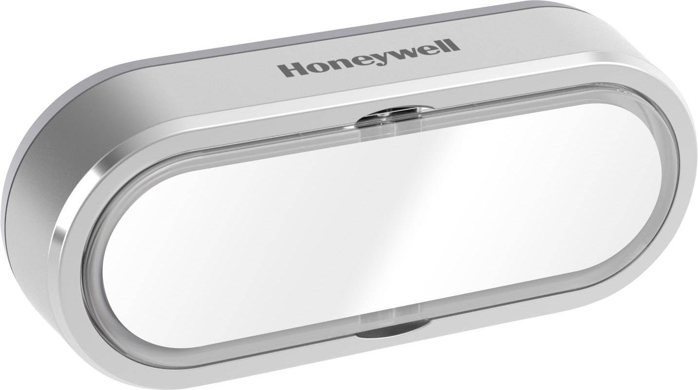 Strieborný, oválny zásobník na papierové vreckovky od spoločnosti Honeywell s priehľadným krytom.