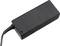 Obdĺžnikový, čierny napájací adaptér s malou svietiacou zelenou LED diódu a káblom pripojeným na ľavej strane.