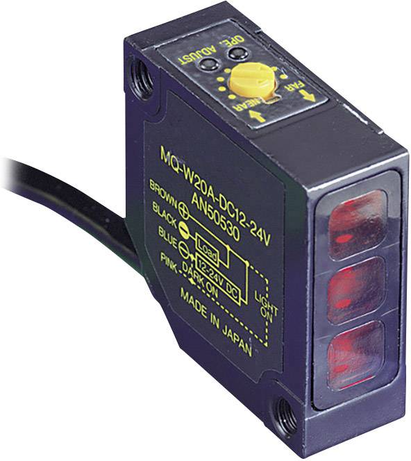 Obdĺžnikový senzor s nápisom 'MG-W20A-DC12-24V'. Má červené senzorové plochy a nastavovacie tlačidlá.