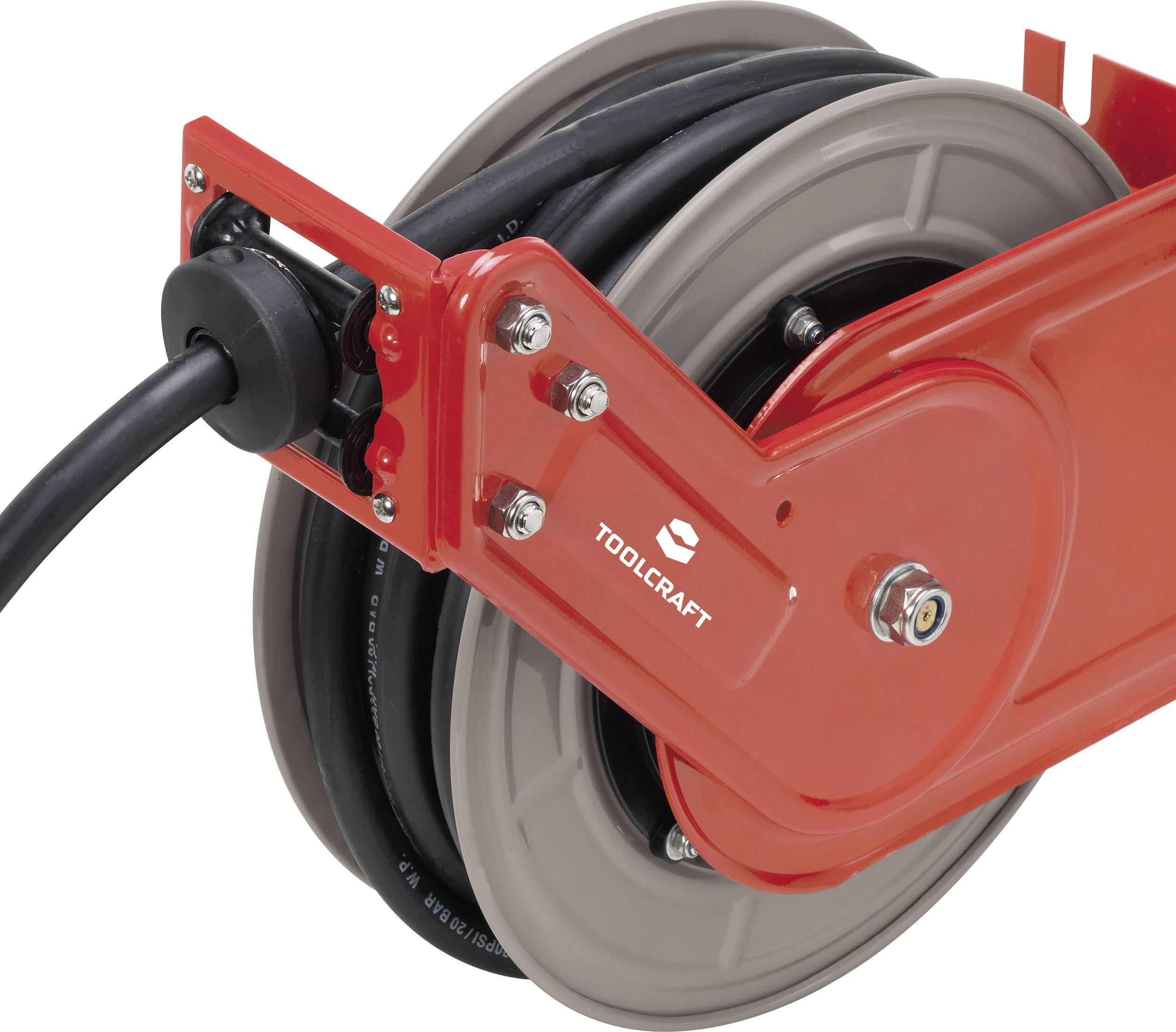 Červená navíjacia káblovka s čiernym káblom, namontovaná na držiaku na stene. Označenie 'Toolcraft' na prednej strane.