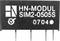 Černý elektronický komponent s nápisom 'HN-MODUL SIM2-0505S 0704' a symbolom v ľavom hornom rohu.