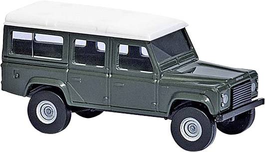 Zelený hračkársky model terénneho automobilu s bielou strechou a štyrmi dverami, stojaci na rovnom povrchu.