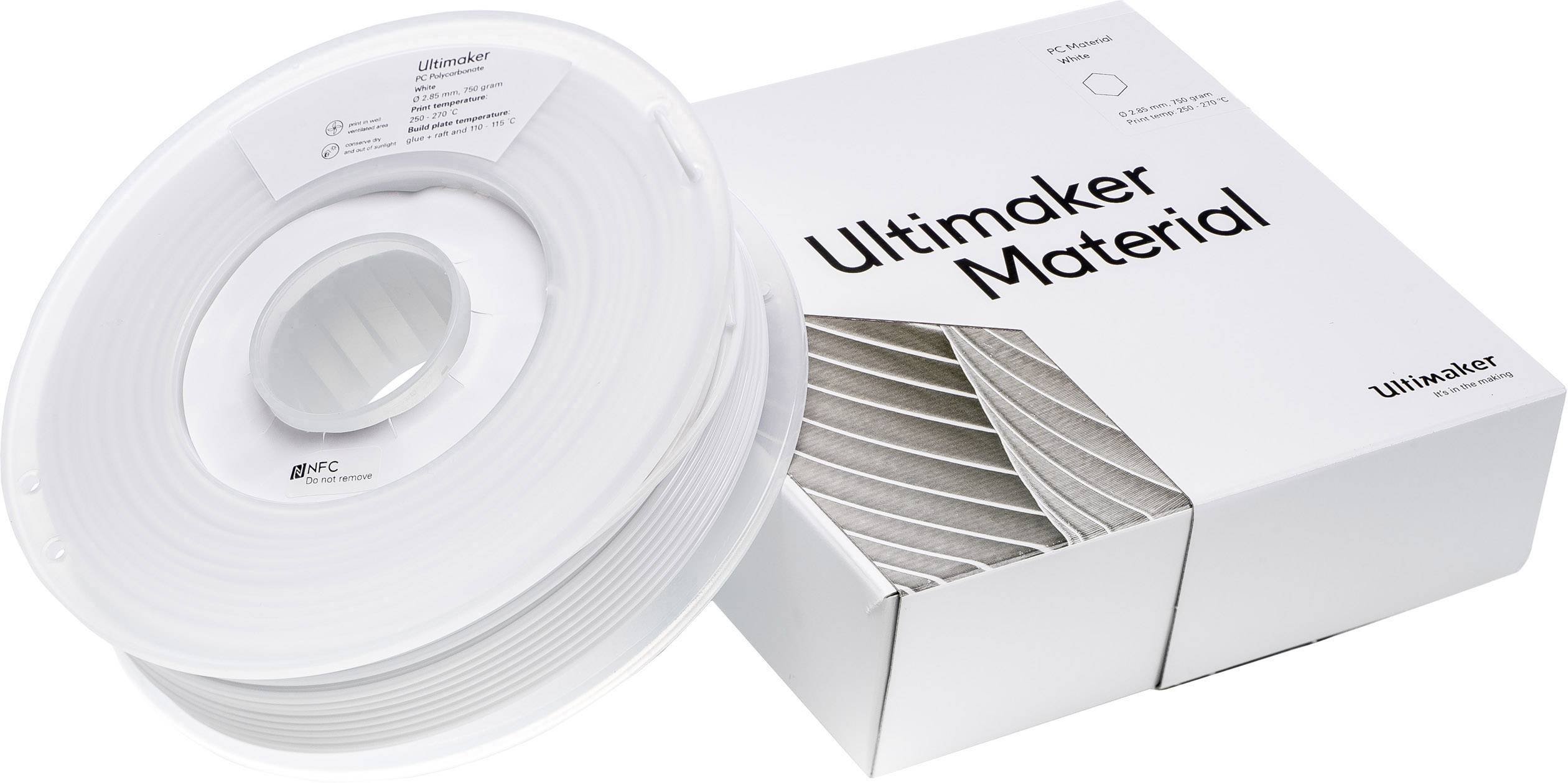 Cievka s bielym 3D tlačiarenským filamentom vedľa obalu s nápisom "Ultimaker Material".