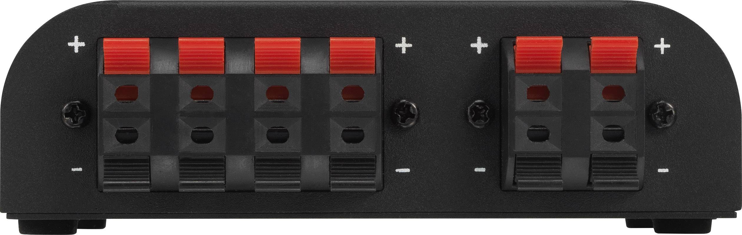 Čierne elektronické zariadenie s červenými a čiernymi svorkami pre káble. Svorky sú označené symbolmi '+' a '-'.