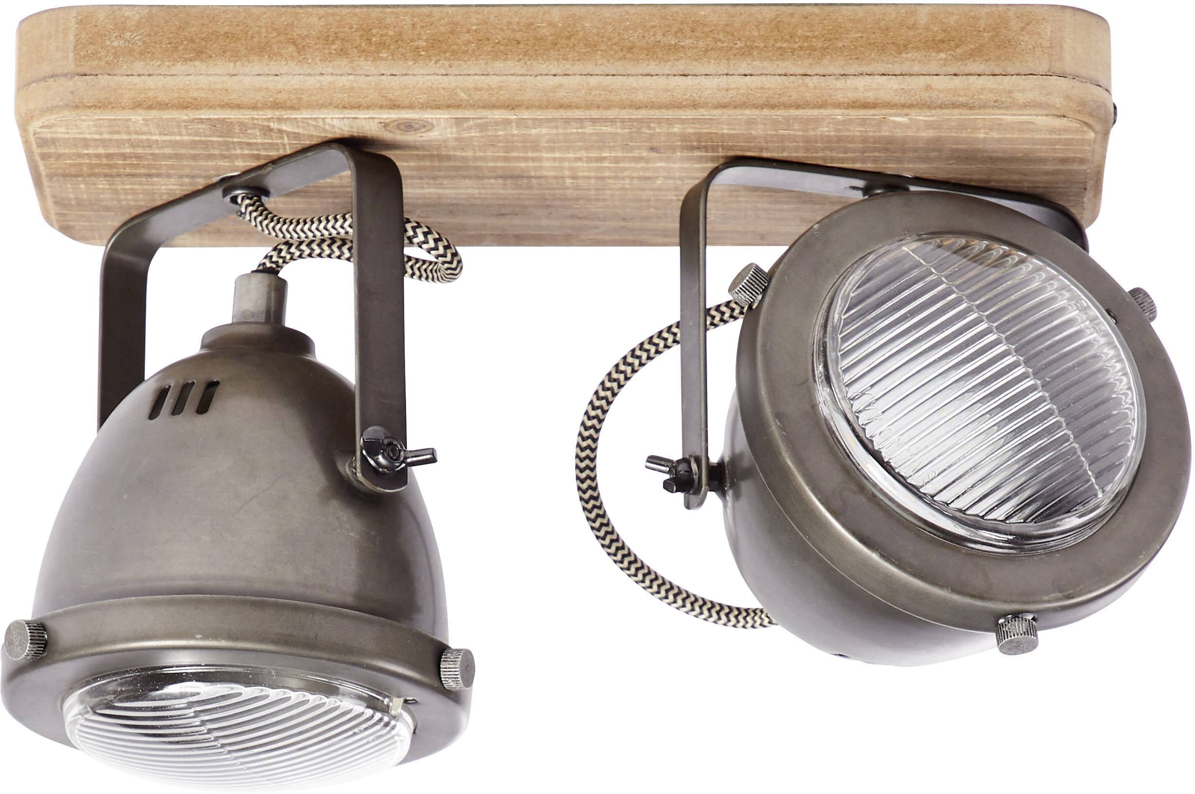 Dva priemyselné stropné reflektory na drevenej konzole. Obe lampy sú v tmavom kovovom prevedení a majú rebrované sklo.