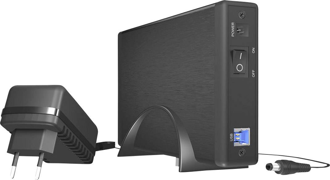 Externý pevný disk v stojane s napájacím adaptérom a USB portom. Hlavný vypínač viditeľný na prednej strane.