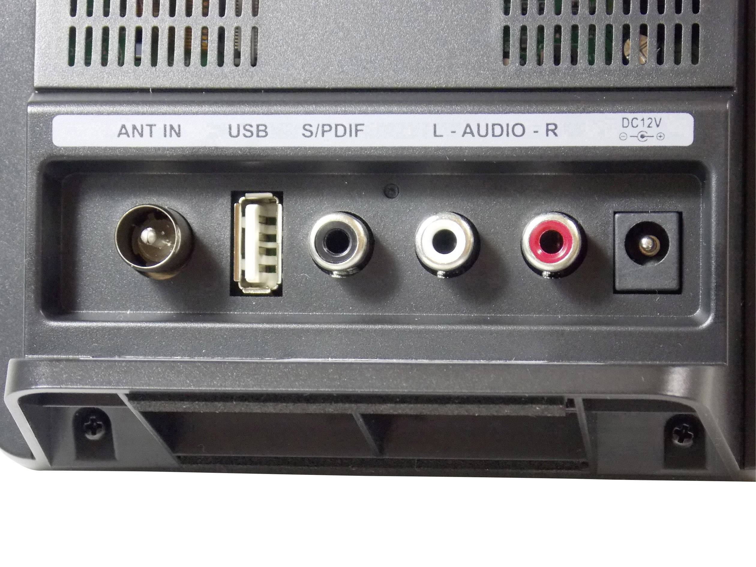 Zadná strana elektronického zariadenia s konektormi: anténny vstup, USB, S/PDIF, L-Audio, R-Audio a DC-12V zásuvka.