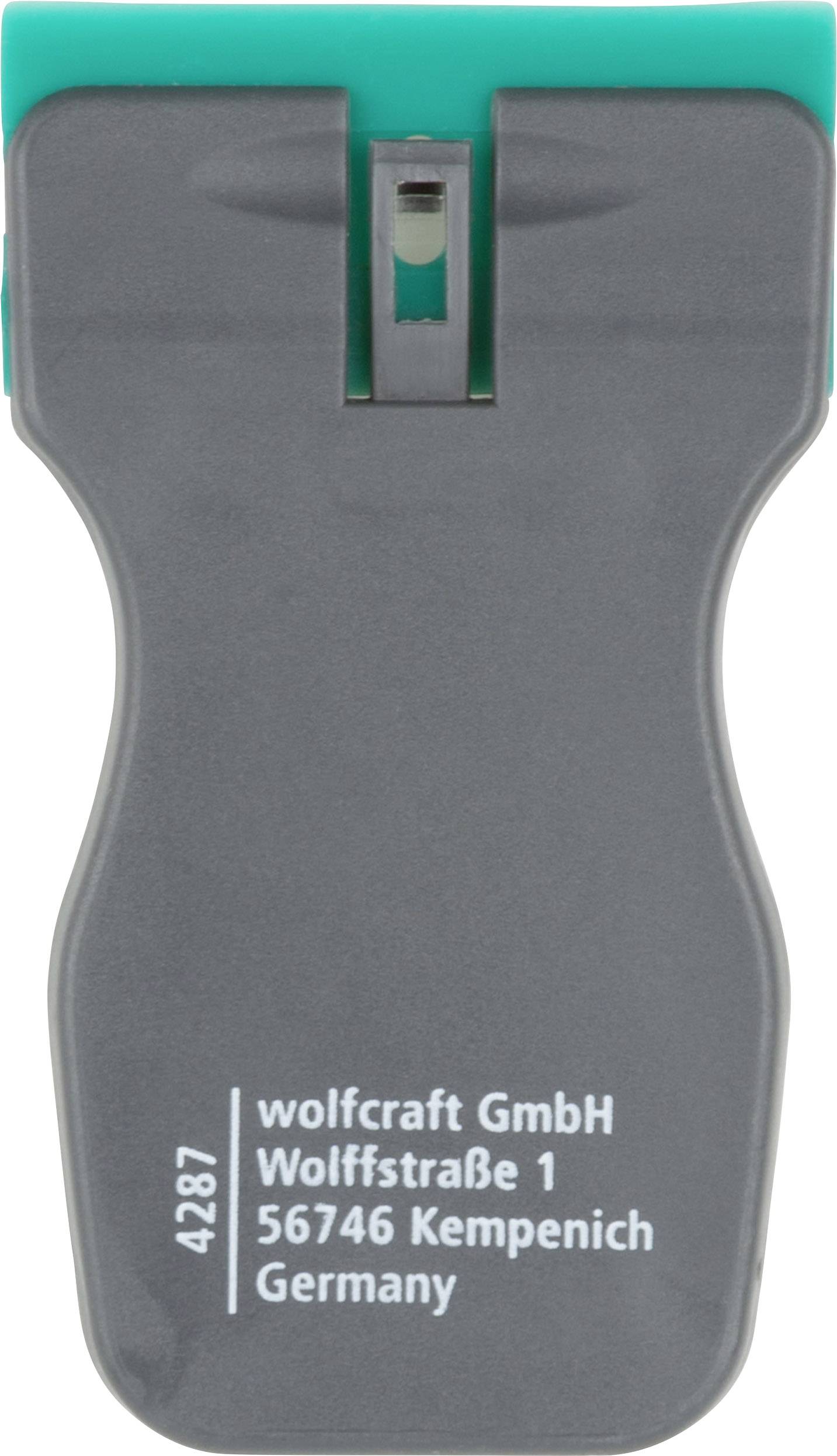 Sivý lapač vápna so zeleným povrchom. Nápis: 'wolfcraft GmbH, Wolffstraße 1, 56746 Kempenich, Nemecko'.
