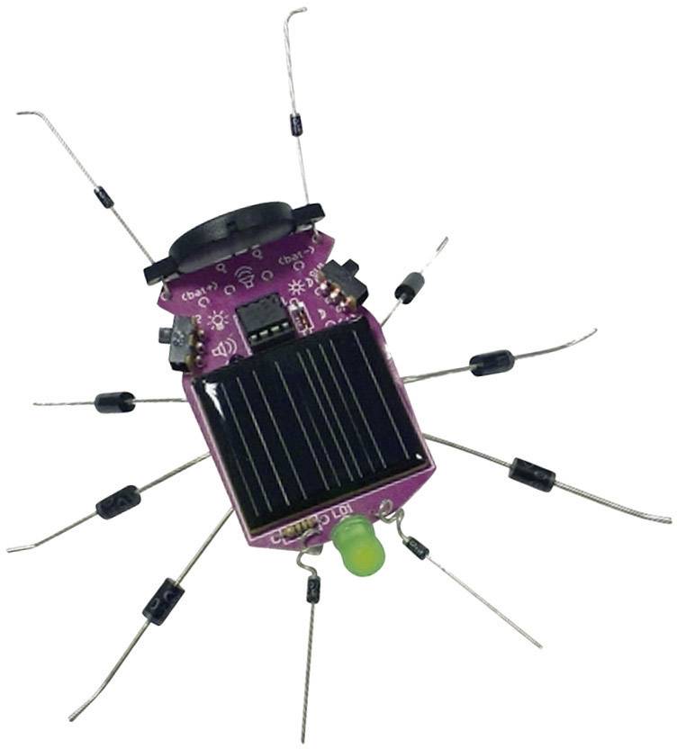 Purpurový robot v tvare pavúka so zeleným LED svetlom a solárnym panelom na chrbte.