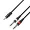Tri audiokáble s rôznymi konektormi: jeden 3,5-mm stereo jack konektor a dva 6,3-mm jack konektory, farebne rozlíšené na červeno a bielo.
