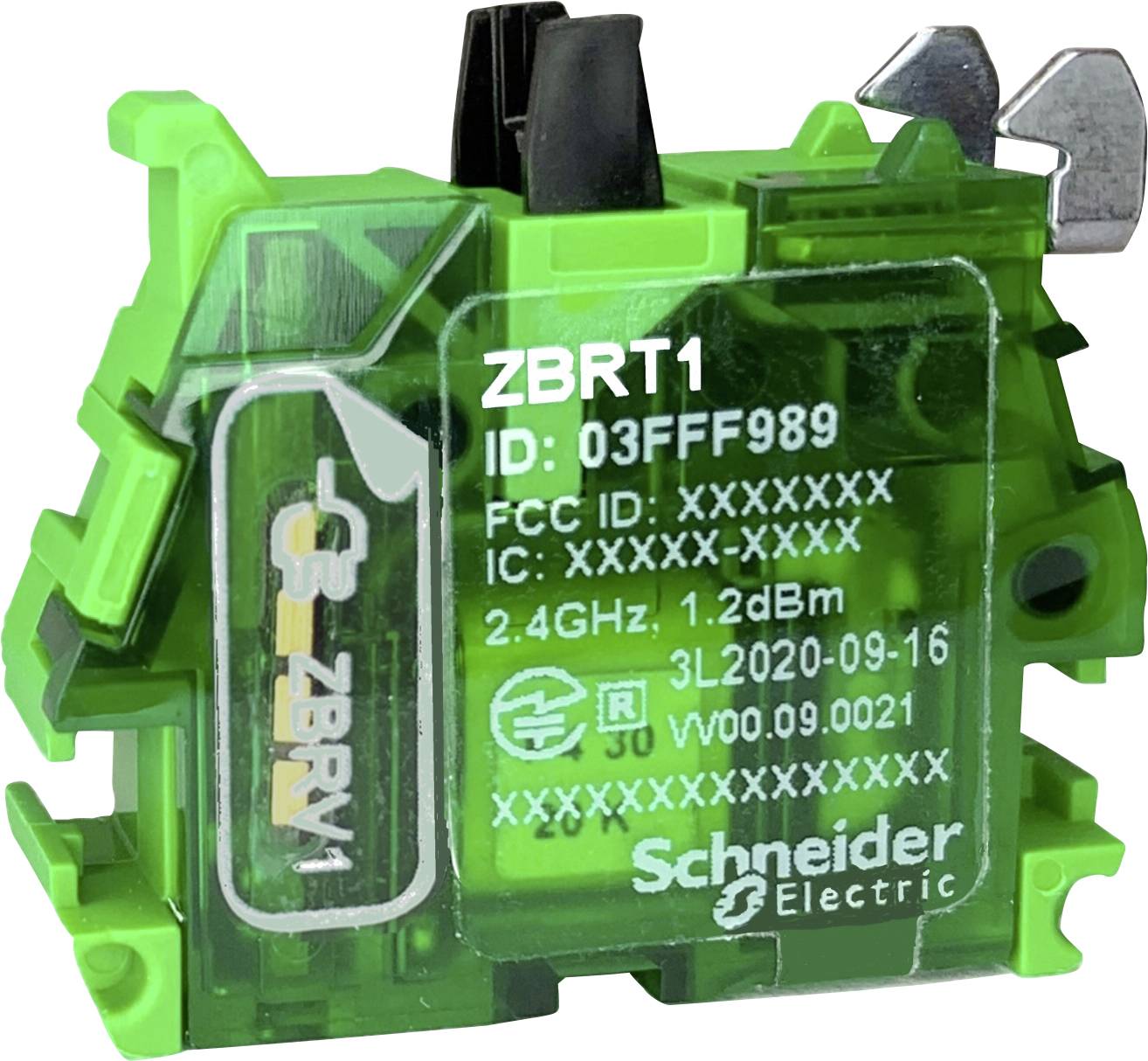 Zelené elektronické zariadenie od Schneider Electric s nápisom 'ZBRT1'. Obsahuje ID 03FF989 a frekvenčný údaj 2,4 GHz 1,2 dBm.
