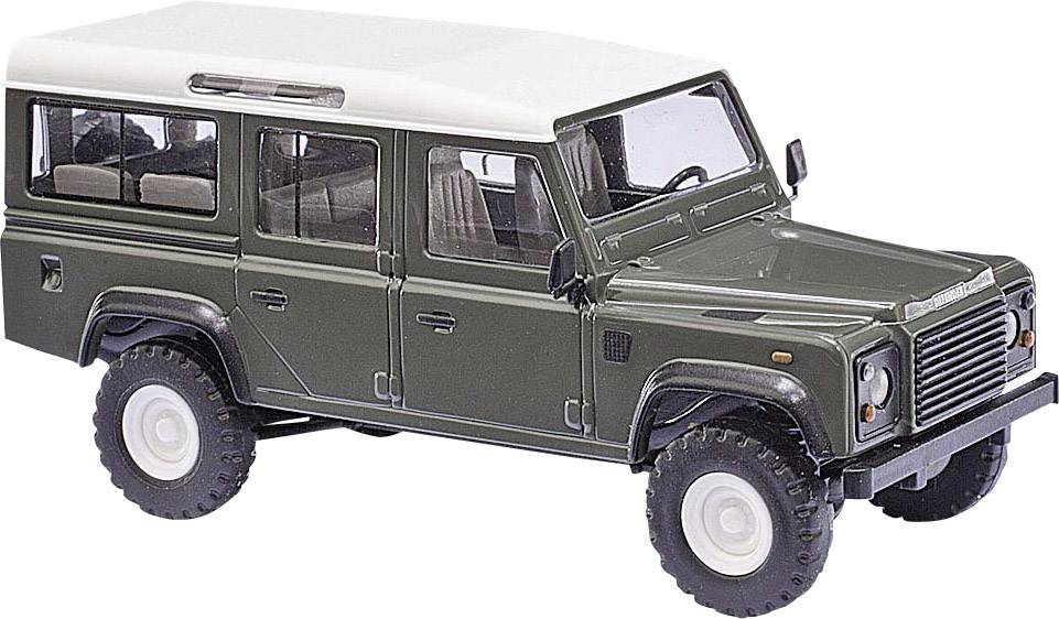 Miniaturový model olivovozeleneho terénneho automobilu s bielou strechou, štyrmi dverami a robustnými pneumatikami. Pohľad zboku spredu zľava.