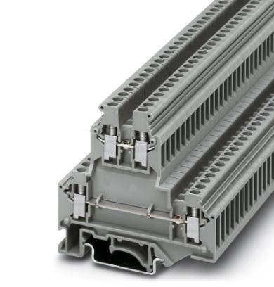 Radová svorka so sivým krytom a viacerými pripojovacími miestami. Navrhnutá na bezpečné a efektívne elektrické prepojenie káblov v rozvádzačoch.