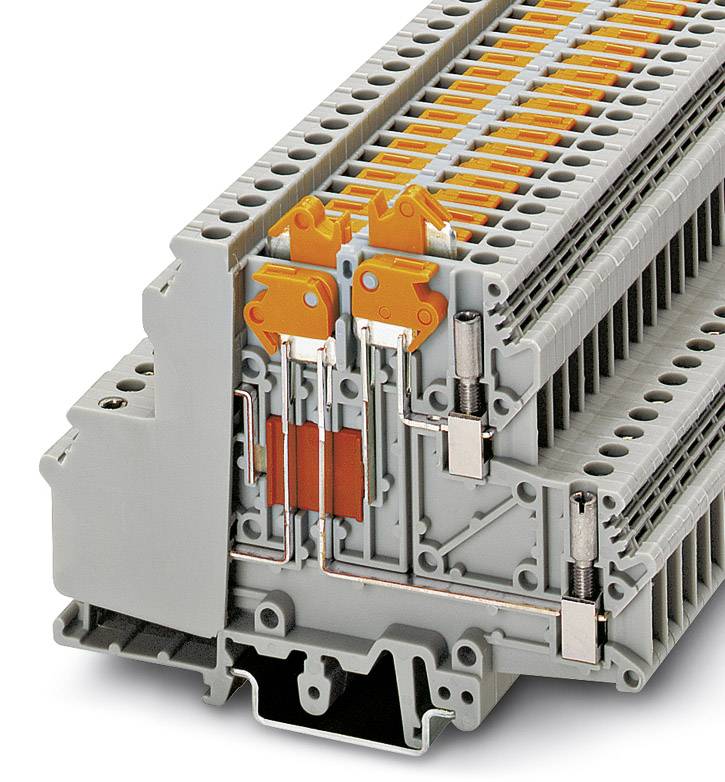 Elektrická pripojovacia svorka, sivá štruktúra s oranžovými pákami, zobrazuje komplikovaný vnútorný návrh zapojenia.