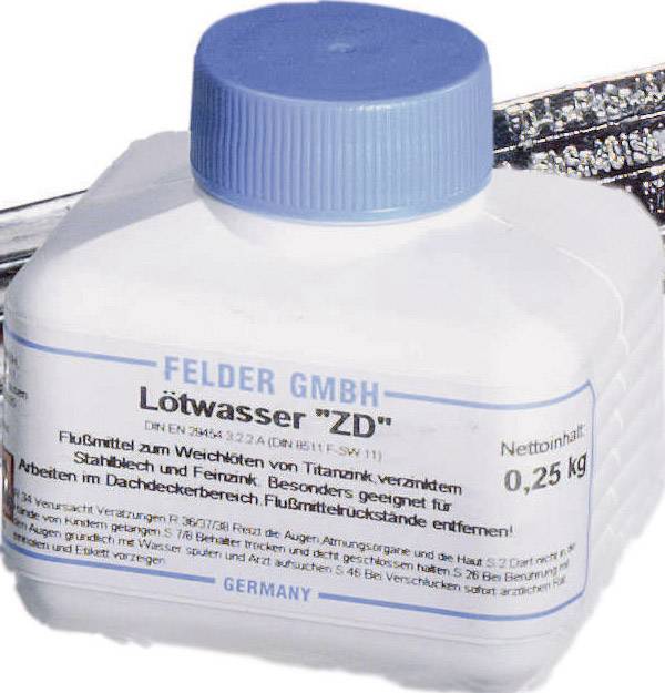 Nádoba s modrou čiapočkou, označená štítkom 'Felder GmbH Lötwasser ZD'. Obsah: 0,25 kg. Vhodné pre obrábanie kovov.