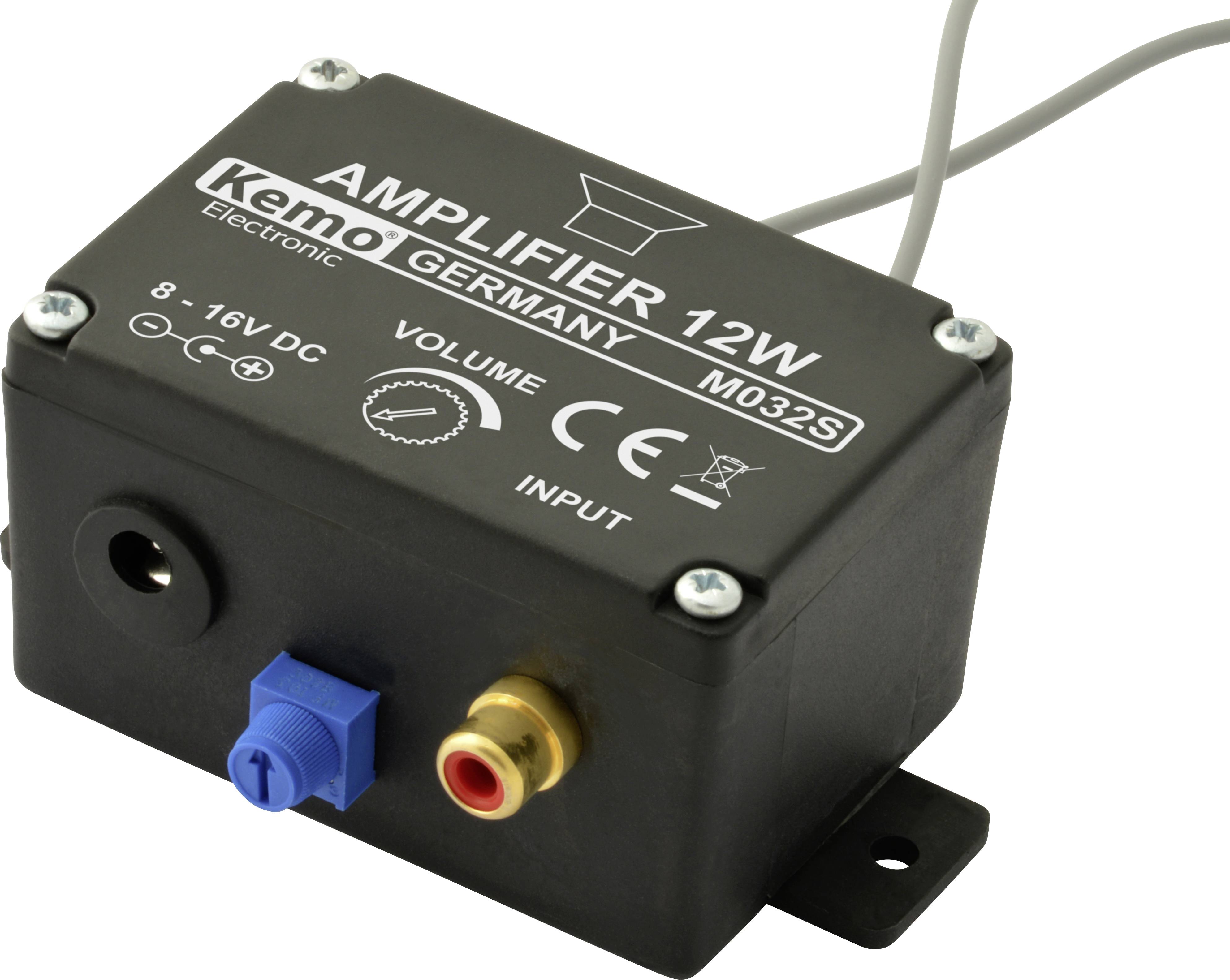 Črni ojačevalec z napisom 'AMPLIFIER 12W' in 'Kemo Germany'. Vidne so priključne vtičnice in regulator glasnosti.