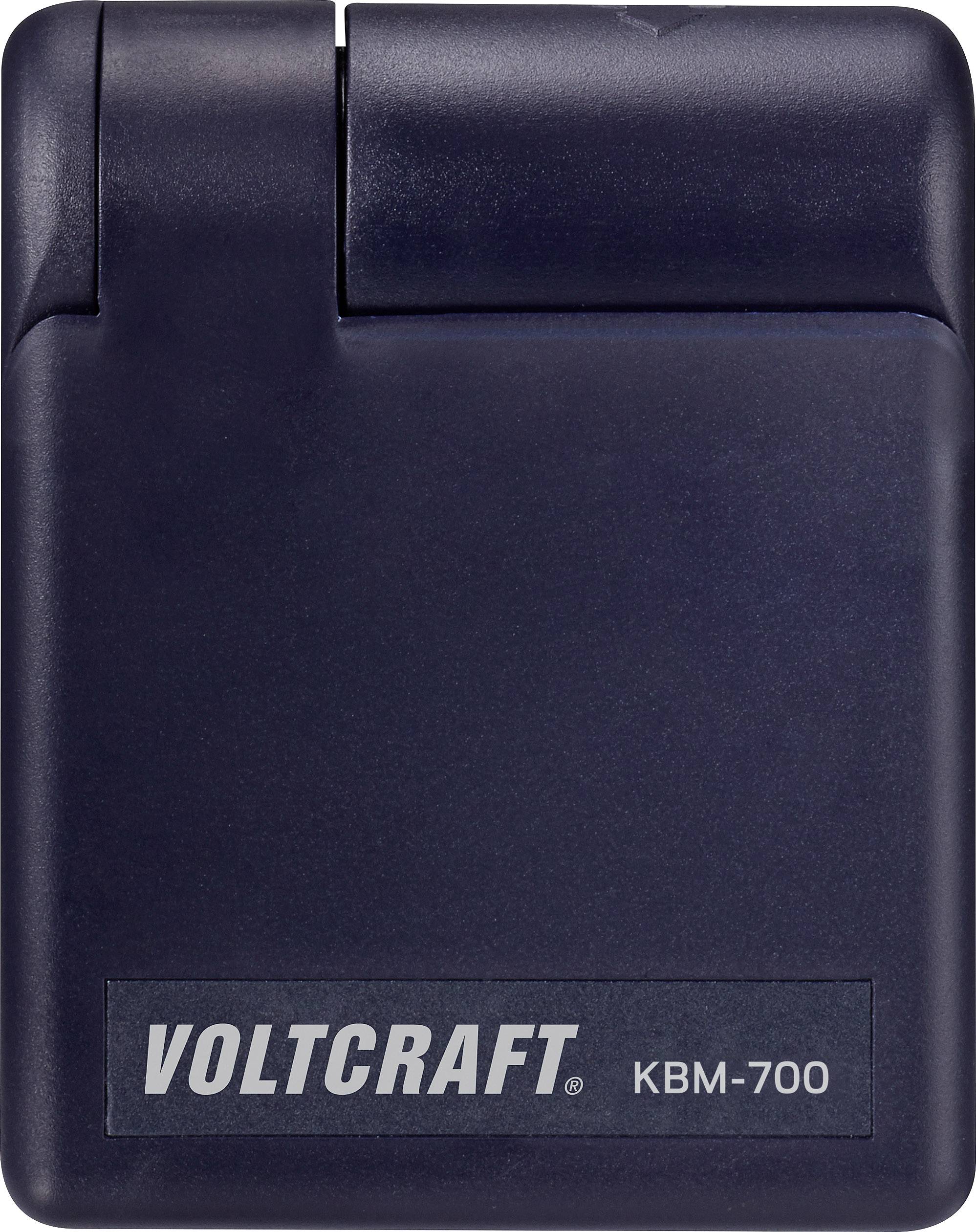 Črna naprava z napisom 'VOLTCRAFT KBM-700', enostavne, kompaktne oblike.