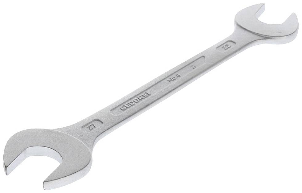 Posamezen srebrn vijačni ključ z dvojnim šestkotnim nastavkom na obeh koncih na beli podlagi.