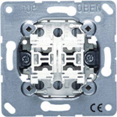 Vgradni električni switch, kovinska plošča, zgornji napis 'ZGORAJ/TOP', kvadratne oblike, centralni mehanizem viden, CE oznaka spodaj desno.