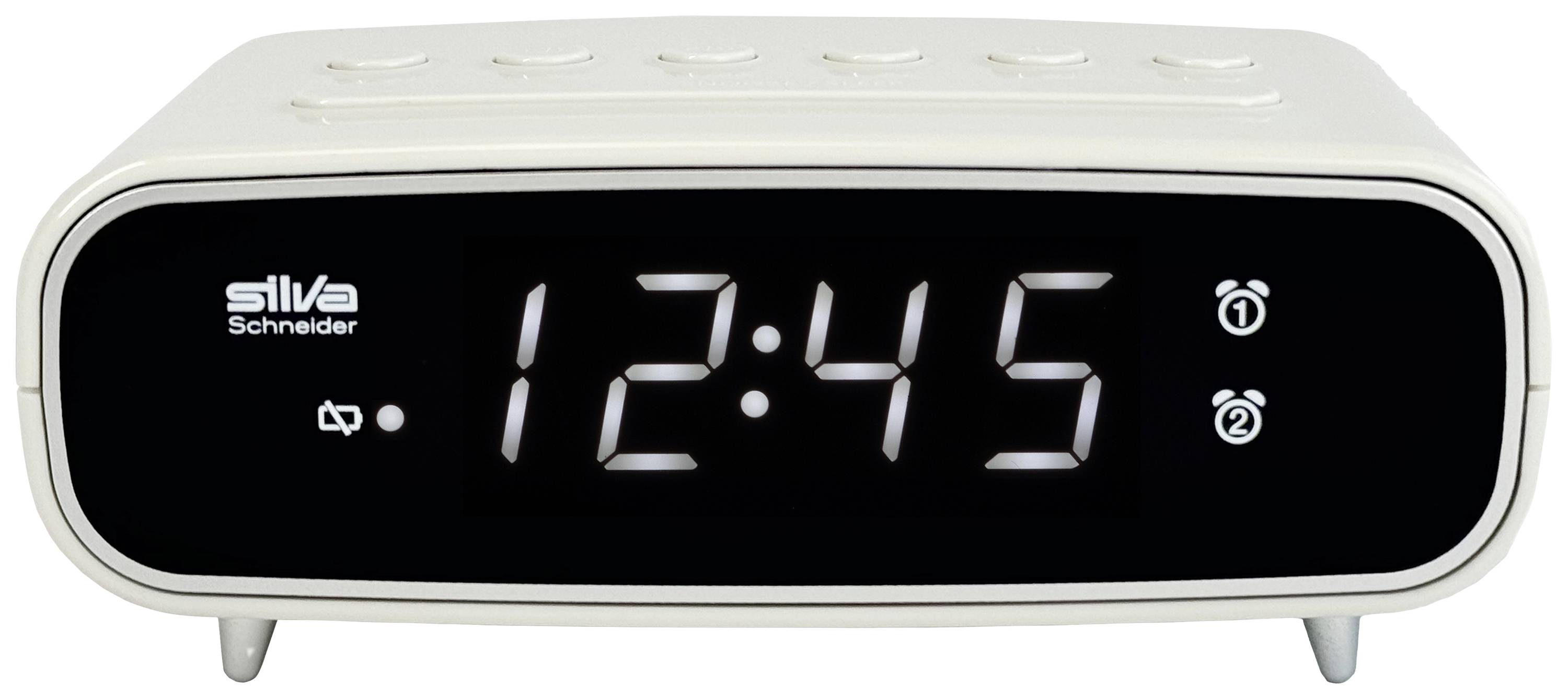 Bel digitalni budilnik prikazuje čas '12:45'. Budilnik ima funkcije za nastavljanje alarma in gumbe na vrhu.