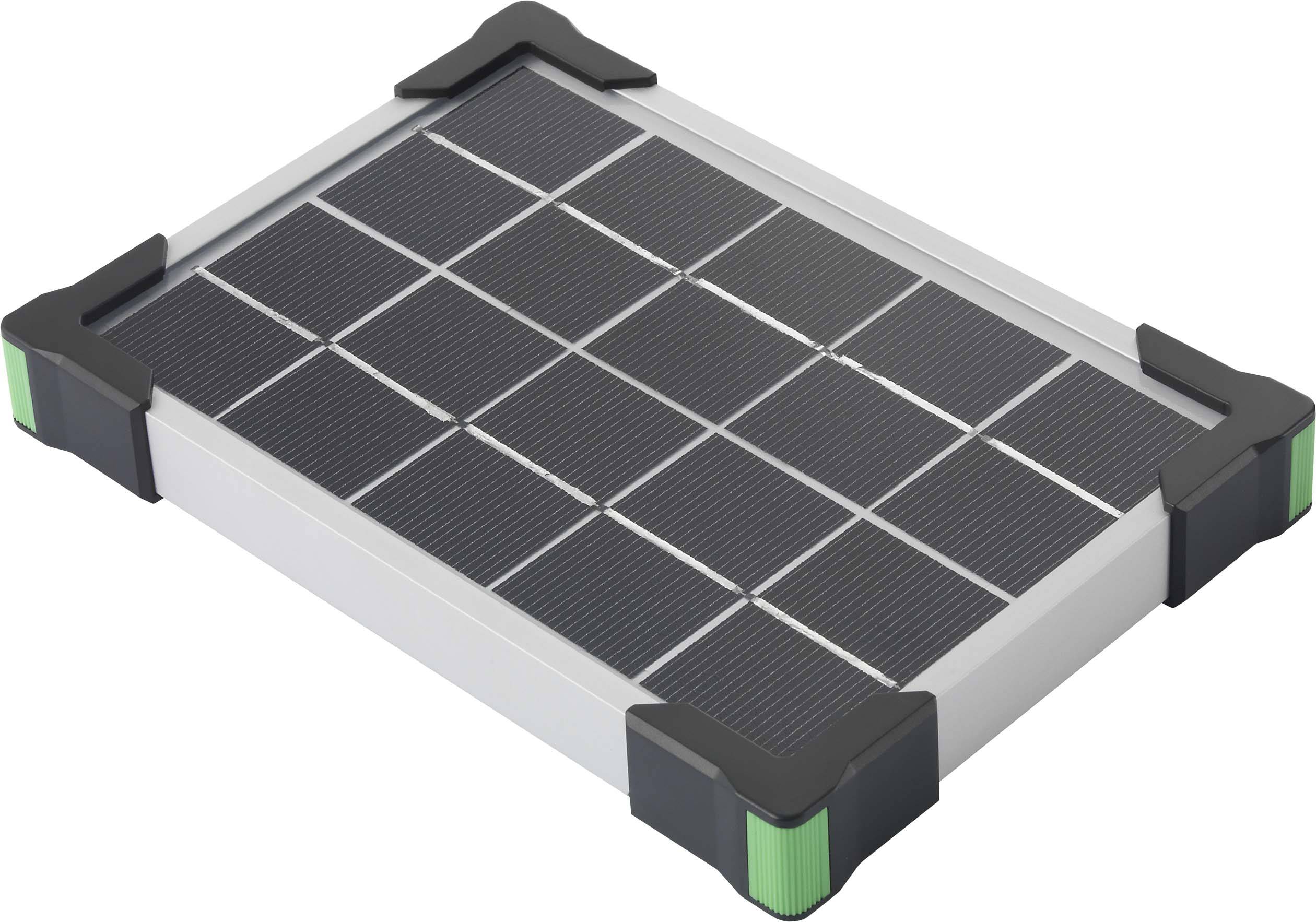 Pravokotni solarni panel z dvanajstimi majhnimi moduli, zaščiten z črnimi vogalnimi pokrovi, leži na sivi podlagi.