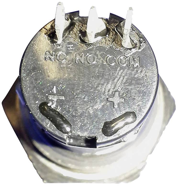 Kovinska, okrogla zgornja plošča elektronske komponente s tremi kovinskimi sponkami in napisi 'NC', 'NO', 'COM'.
