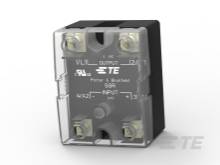 Črna, pravokotna elektronska komponenta s prozorno sprednjostjo prikazuje priključne sponke in napis 'Power & Troitement SSR INPUT 4/32 VDC OUTPUT 24-480 VAC'.
