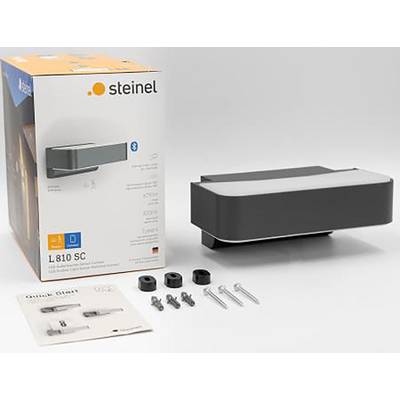 Embalaža in posamezni deli zunanje stenske svetilke Steinel z modelno številko L810 SC. Vidno je dodatna oprema in navodila.