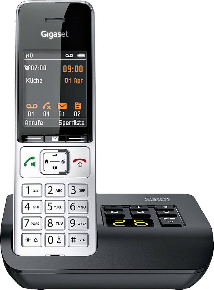 Brezžični telefon z polnilno postajo. Zaslon prikazuje datum, uro in vrstico simbolov. Tipke za sprejem klica in navigacijski meni.